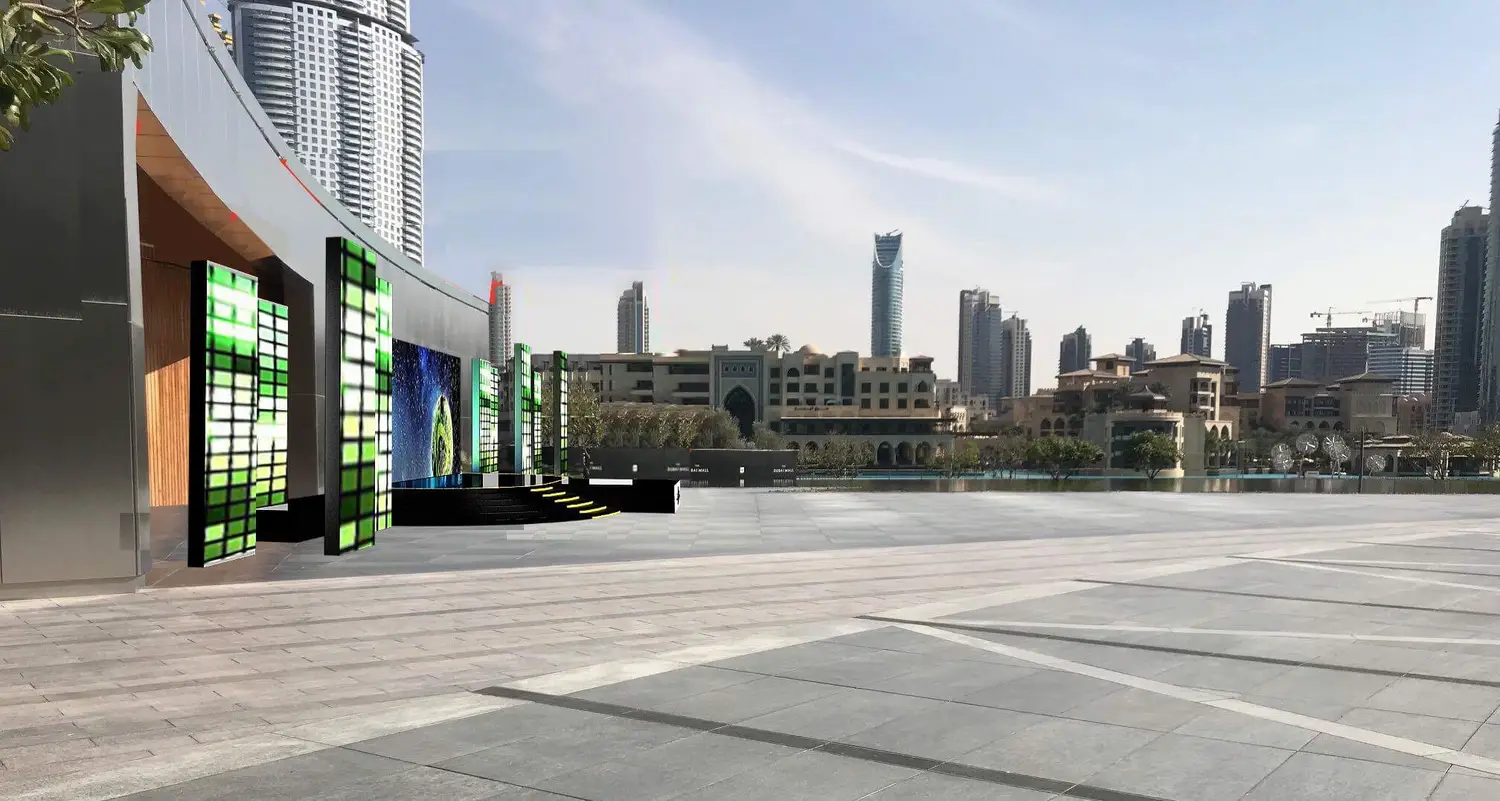 The towers of light drawn onto the photograph of the terrace, the lake and Downtown Dubai behind