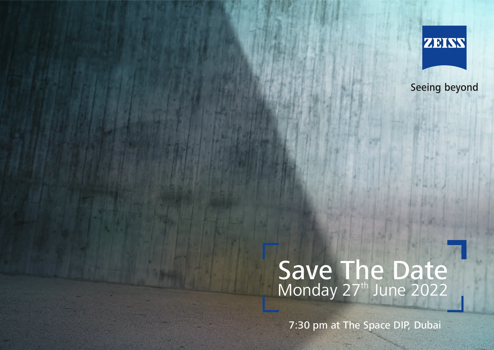 Save the date: light on a concrete wall, Monday 27th June 2022